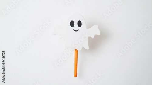 Handcrafted Halloween bookmark featuring a ghost on a craft stick isolated on a white background with clipping path