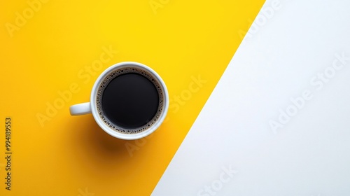 Top view of a coffee cup on a yellow and white background