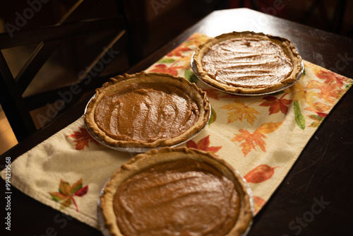 Homemade Pumpkin Pies on Festive Tablecloth