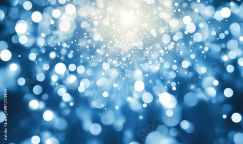 Elegant blue backdrop featuring white bokeh lights glowing at the center with a blurred zoom effect creating a dazzling display of white light orbs and a bright blue edge