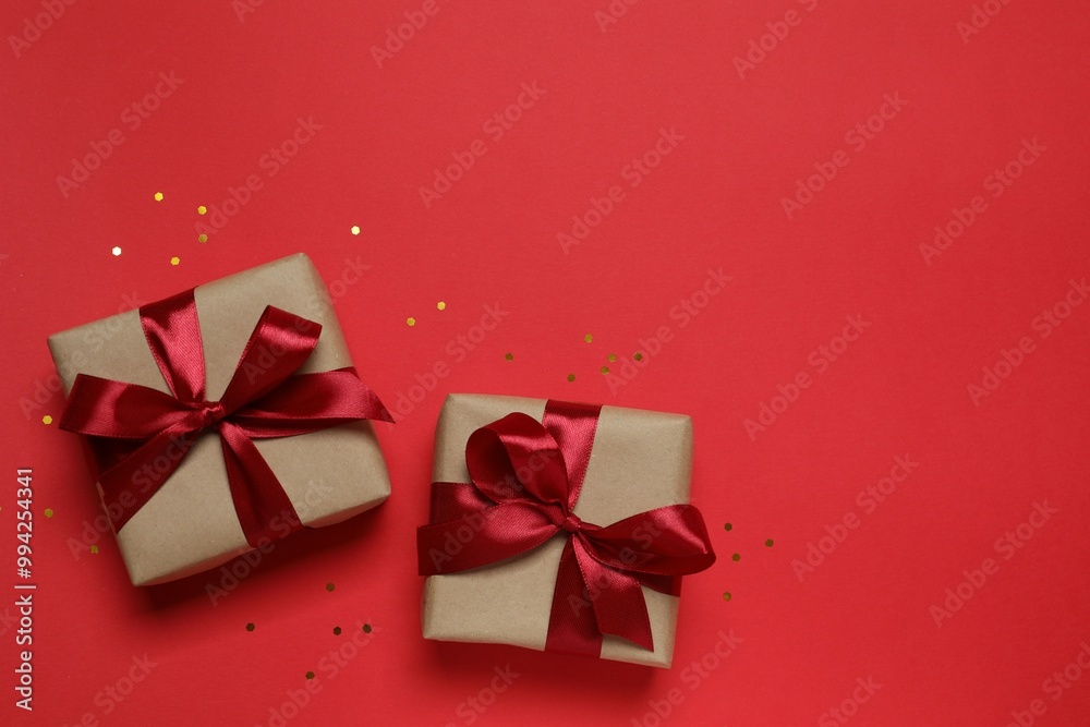 Beautiful gift boxes with confetti on a colored background Beautiful gift boxes with confetti on a colored background