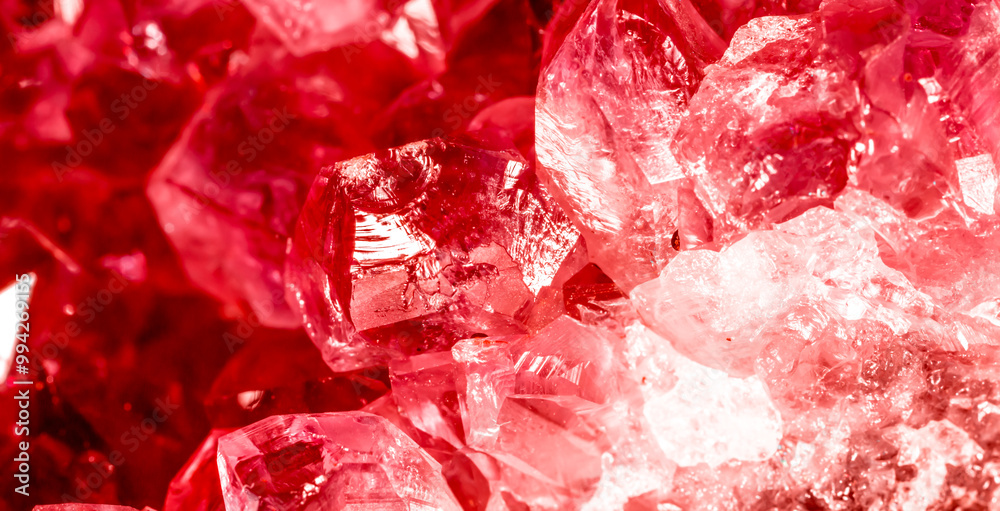 Amethyst red crystals. Gems. Mineral crystals in the natural environment. Texture of precious and semiprecious stones. Seamless background with copy space colored shiny surface of precious stones. Amethyst red crystals. Gems. Mineral crystals in the natural environment. Texture of precious and semiprecious stones. Seamless background with copy space colored shiny surface of precious stones.
