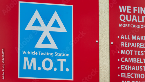 MOT Vehicle Testing Station Sign on a Red Background photo