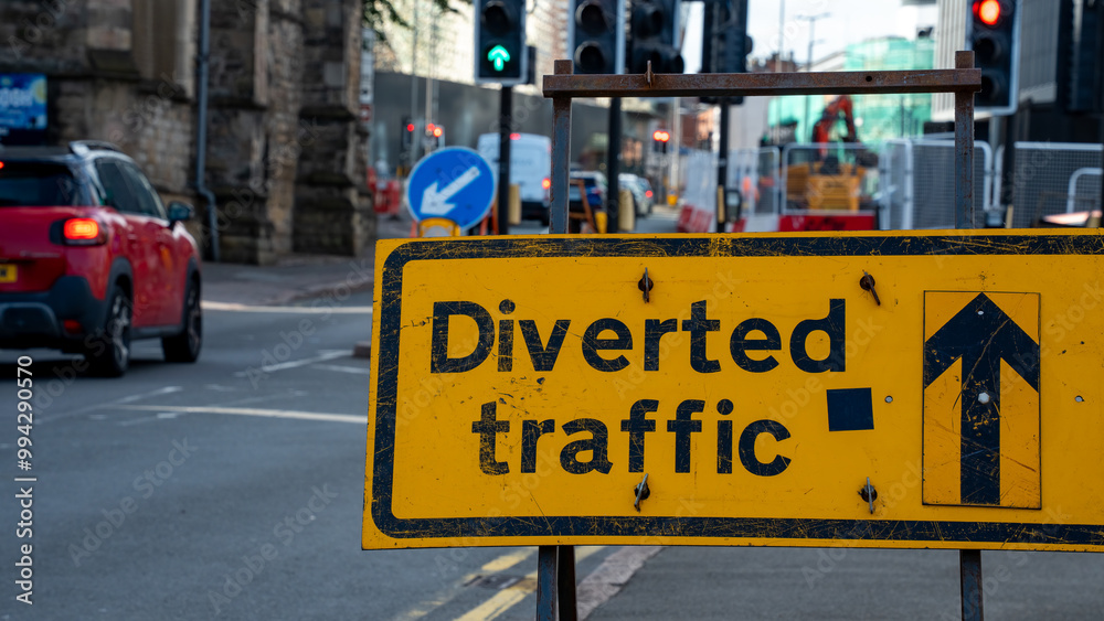 Fototapeta premium Yellow Diverted Traffic Sign on a City Street