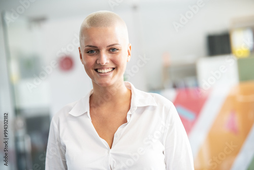 In her college office, a determined female student stands confidently, a beacon of empowerment and knowledge, ready to conquer academic challenges and embrace her future. 