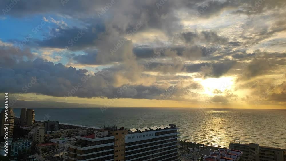 Timelapse view of sunrise on the mediterranean coast of Spain overlooking the sea, coastline and residential sector of Torremolinos. Timelapse view of sunrise on the mediterranean coast of Spain overlooking the sea, coastline and residential sector of Torremolinos.