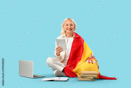 Mature woman with tablet co...