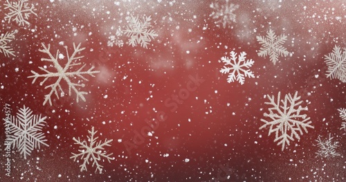 Winter snowflakes gently falling on a festive red background during the holiday season