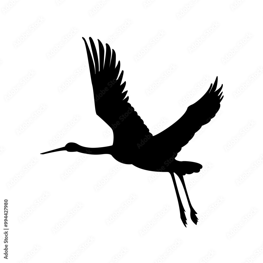 Obraz premium The silhouette of a flying crane, a stork