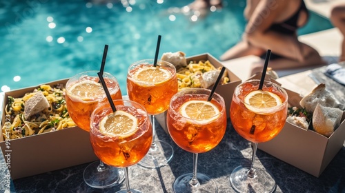 Aperol spritz in six glasses photo