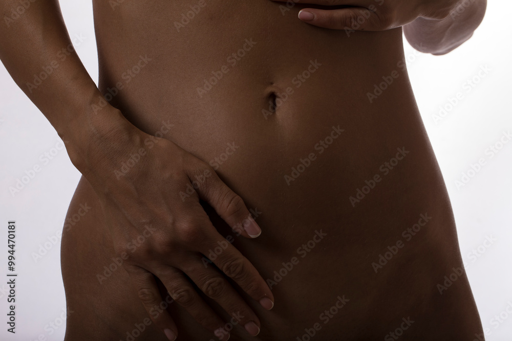 Naklejka premium Fat woman hand holding fat belly. Diet belly. 