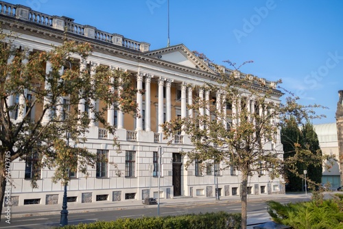 Old building in the financial district of a city. Bank next to the street