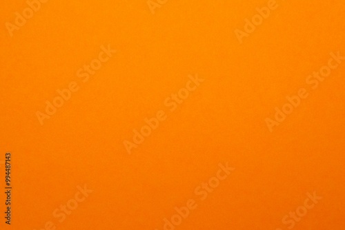 Orange textured sheet background. Empty space for text