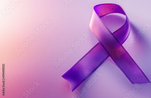 a purple cancer awareness ribbon on a light background