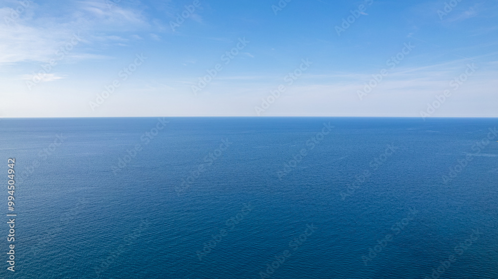 Aerial View of Calm Blue Ocean and Clear Sky Horizon Aerial View of Calm Blue Ocean and Clear Sky Horizon