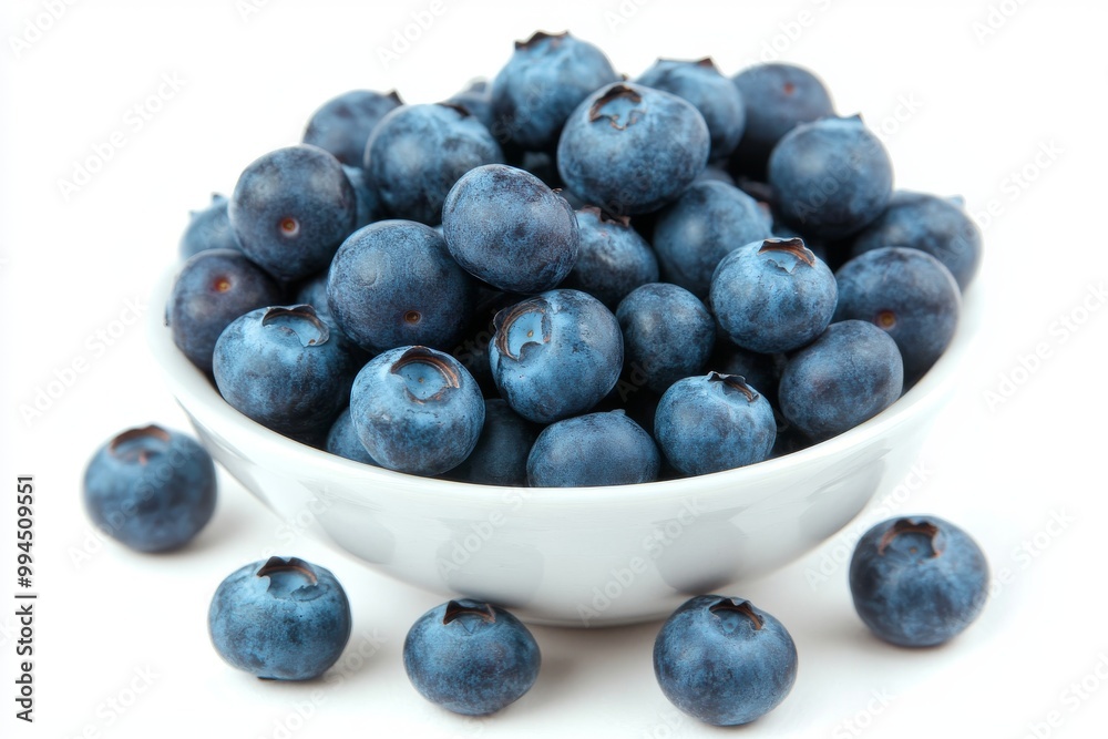 The background of the image is textured marble with ripe blueberries in the foreground The background of the image is textured marble with ripe blueberries in the foreground