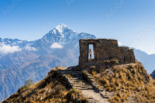 Tableau sur toile young woman looking at the imposing intipunku gate of the sun with the backgro