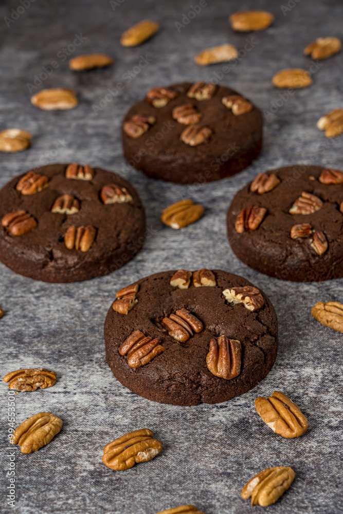 Homemade cookies with pecan nuts on a gray background Homemade cookies with pecan nuts on a gray background