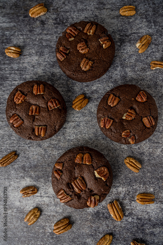 Homemade cookies with pecan nuts on a gray background Homemade cookies with pecan nuts on a gray background