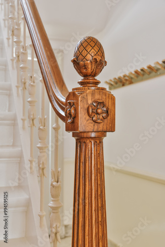 Classic wooden newel post on staircase