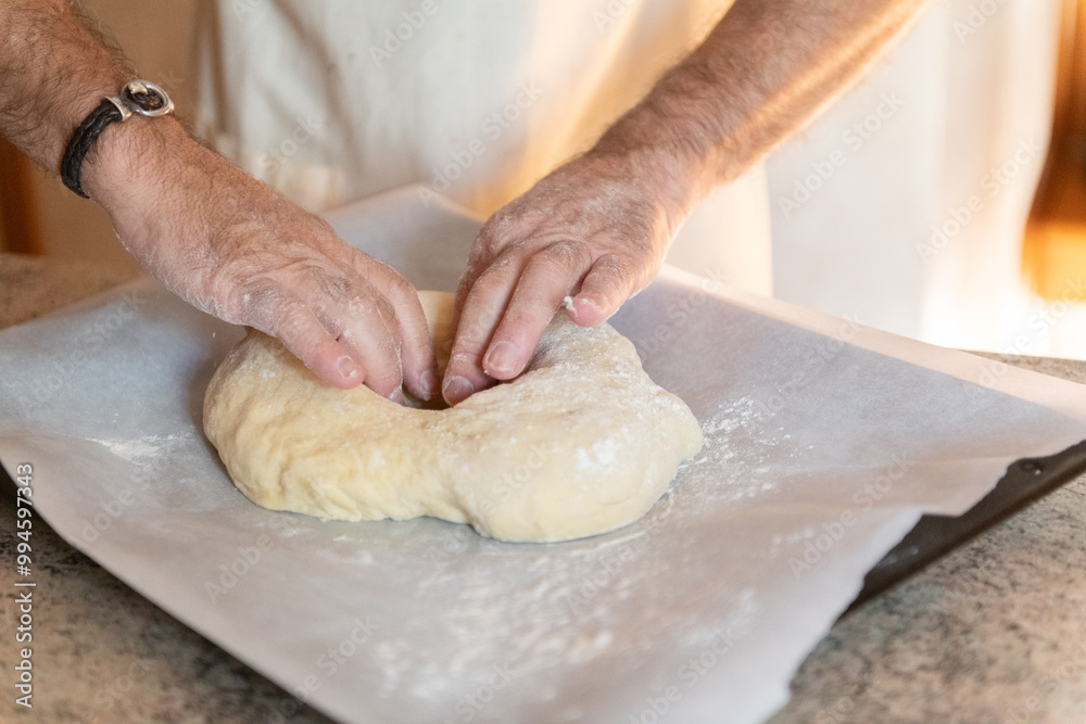 Elderly hands shaping traditional Three Kings Cake dough Elderly hands shaping traditional Three Kings Cake dough