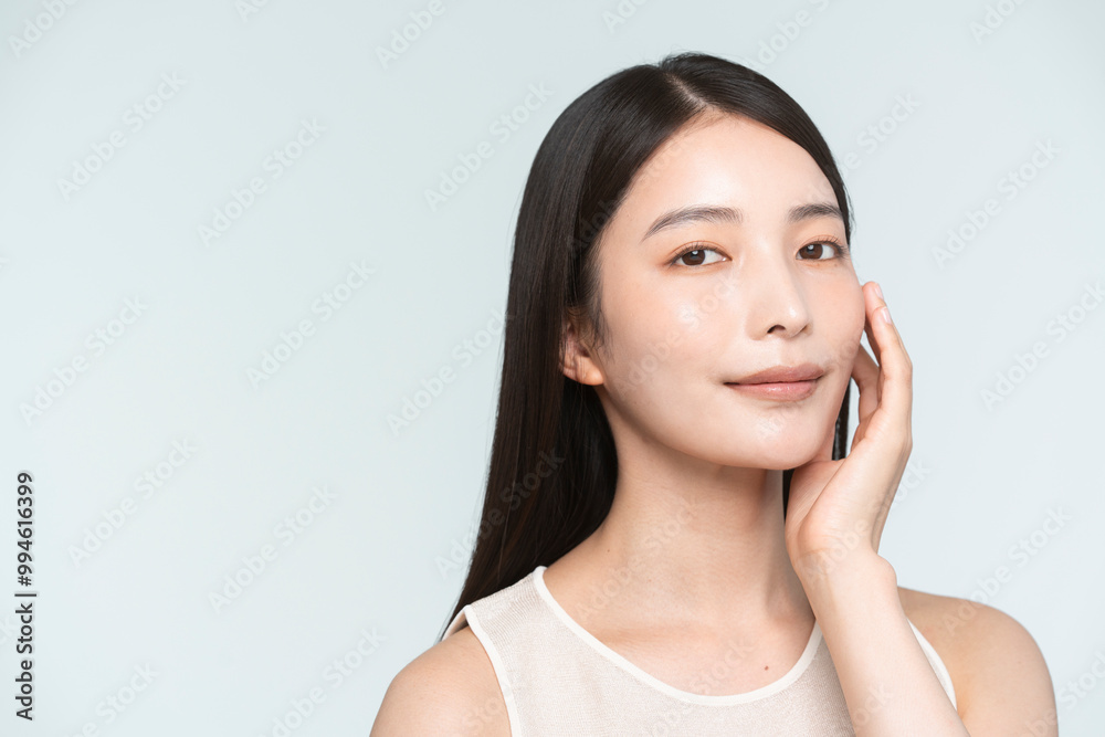 Skin care. Woman with beauty face touching healthy facial skin portrait. Asian woman.
Skin care. Woman with beauty face touching healthy facial skin portrait. Asian woman.
