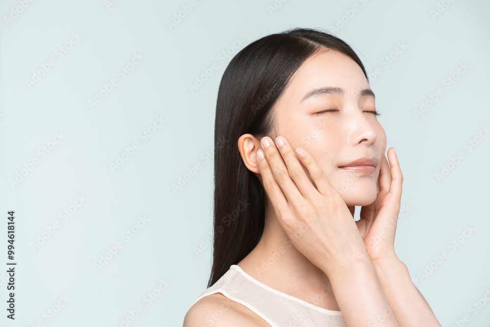 Skin care. Woman with beauty face touching healthy facial skin portrait. Asian woman.
Skin care. Woman with beauty face touching healthy facial skin portrait. Asian woman.