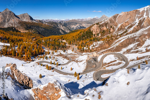 Izoard Pass (Col d'Izoard), the scenic D902 road and Napoleon Refuge in Autumn with snow. Queyras Regional Natural Park, Hautes-Alpes (05), Alps, France photo