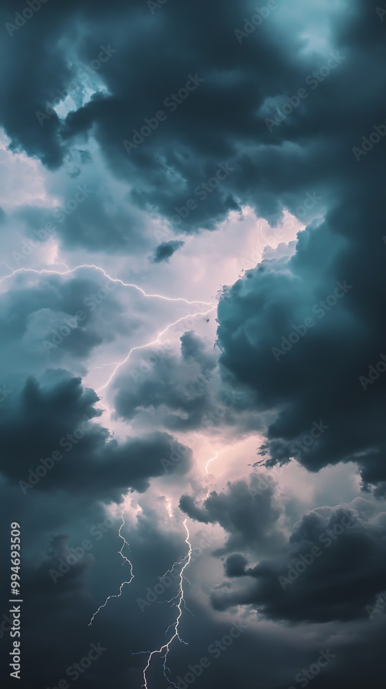 Multiple Clouds Emit Ground Light Under a Dark, Stormy Sky Multiple Clouds Emit Ground Light Under a Dark, Stormy Sky