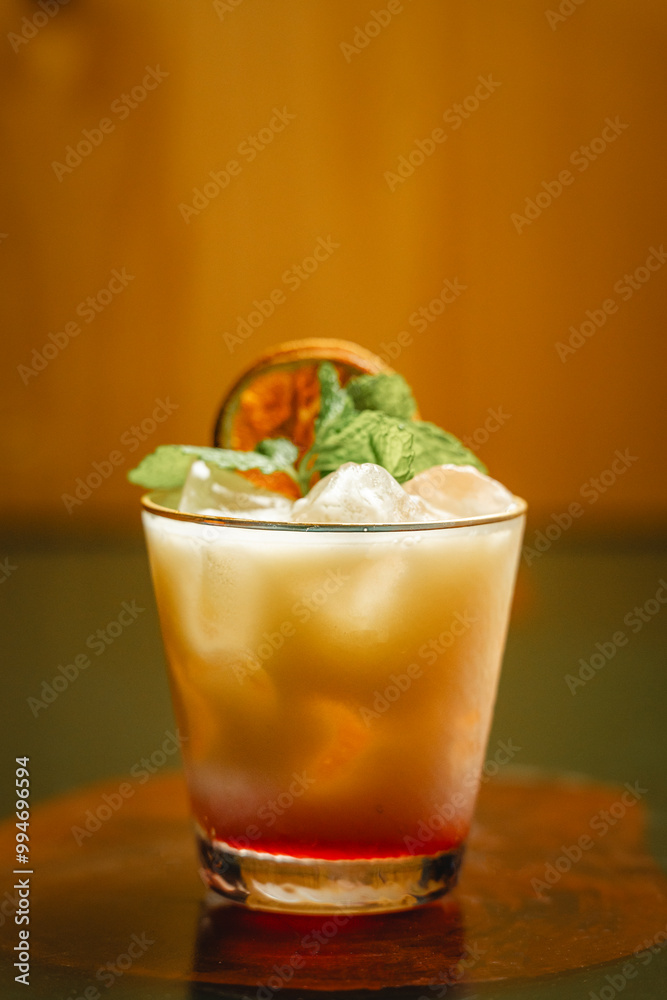 A detailed close up of a beautifully crafted cocktail in a glass on a table A detailed close up of a beautifully crafted cocktail in a glass on a table