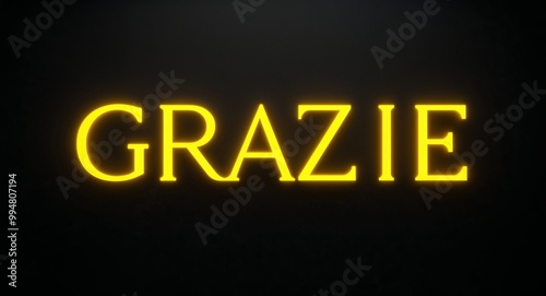 grazie word lettering with yellow glow on plain black dark background