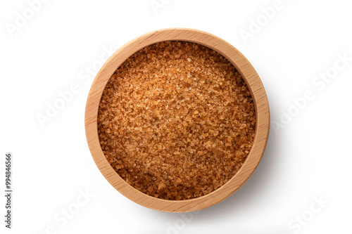 Top view of Brown sugar in a wooden bowl isolated