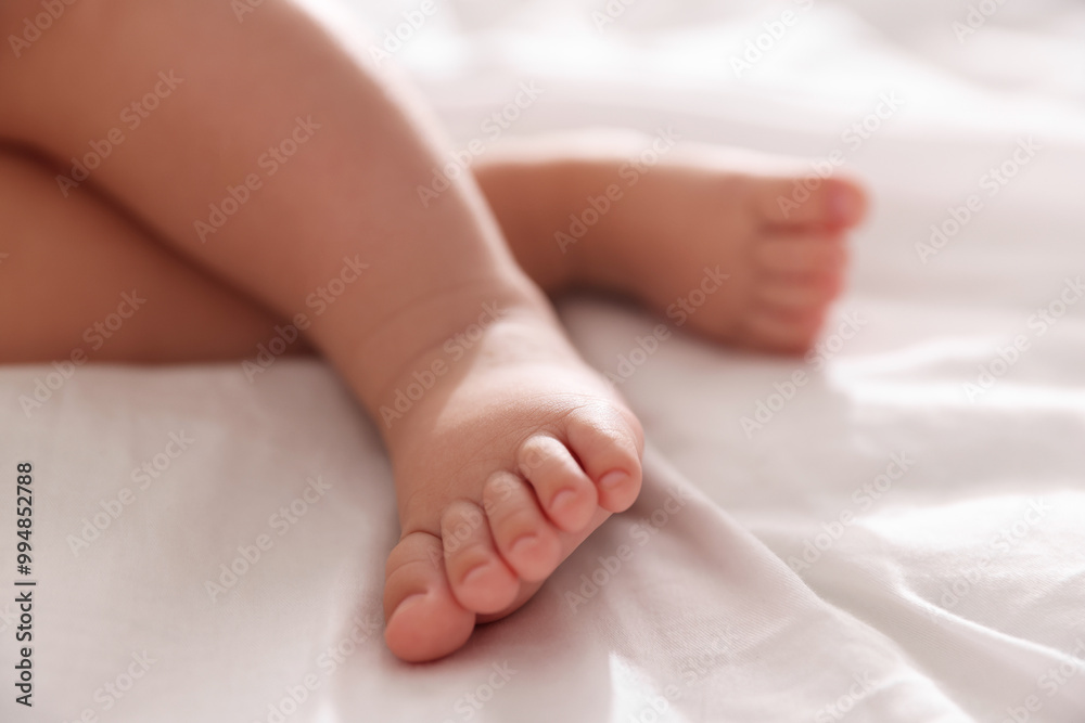 Cute little baby sleeping on bed at home, closeup Cute little baby sleeping on bed at home, closeup