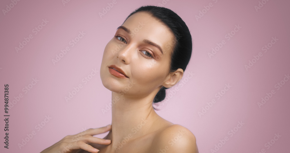 Elegant Brunette Woman with Bright Evening Makeup on Pink Background