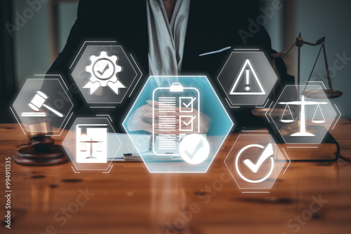 Business professional reviewing regulation concepts with digital icons representing law, compliance, and risk management on a virtual interface.