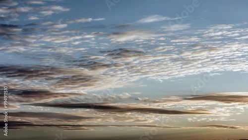Stunning sunrise sky with illuminated altostratus clouds