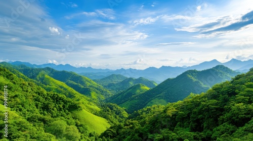 Breathtaking view of lush green mountains under a bright blue sky.