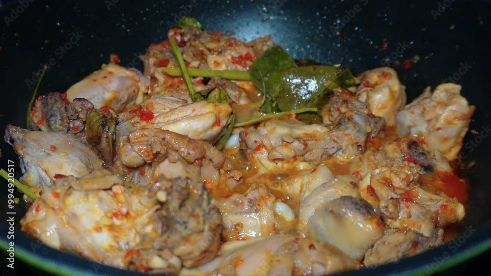 the process of covering chicken that has been smeared with Padang spices so that it is completely absorbed, before grilling the chicken the process of covering chicken that has been smeared with Padang spices so that it is completely absorbed, before grilling the chicken
