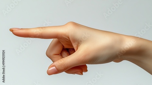 A white-skinned female hand points with an index finger, demonstrating a clear gesture against a plain white background.