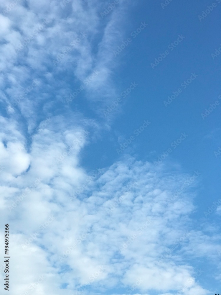 clear blue sky with scattered cloud in the middle of the day clear blue sky with scattered cloud in the middle of the day