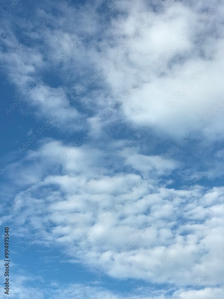 clear blue sky with scattered cloud in the middle of the day clear blue sky with scattered cloud in the middle of the day