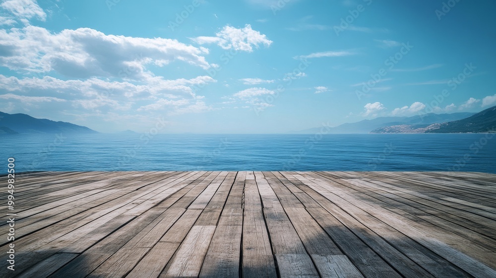 Fototapeta premium A wooden platform without barriers, facing a vast ocean