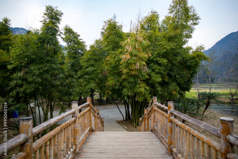 Fototapeta premium An ancient village called Bamei in eastern Yunnan, China, with rapeseed flowers and terraced fields