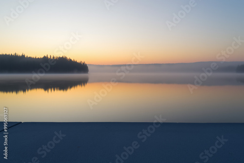 Concrete Surface with Sunrise Over Calm Lake.generative AI