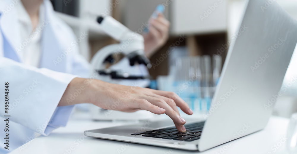 Researchers Conducting Experiments and Analyzing Substances in a Modern Laboratory Setting Researchers Conducting Experiments and Analyzing Substances in a Modern Laboratory Setting