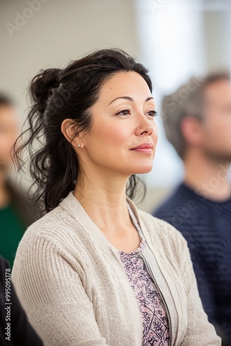 A group participating in a workshop about mindfulness techniques. The shared learning experience enhances personal growth