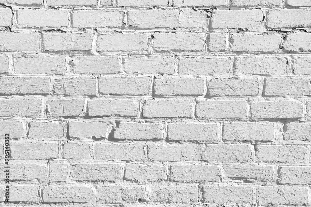 Fototapeta premium A gray brick wall. The texture of old bricks. Horizontal image of brickwork.