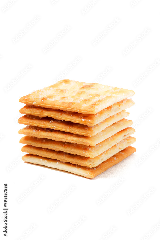 A stack of sweet crispy cracker sprinkled with sugar on top, set against a clean white background. The golden brown crackers create a simple yet appetizing display A stack of sweet crispy cracker sprinkled with sugar on top, set against a clean white background. The golden brown crackers create a simple yet appetizing display