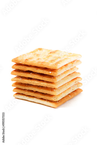 A stack of sweet crispy cracker sprinkled with sugar on top, set against a clean white background. The golden brown crackers create a simple yet appetizing display