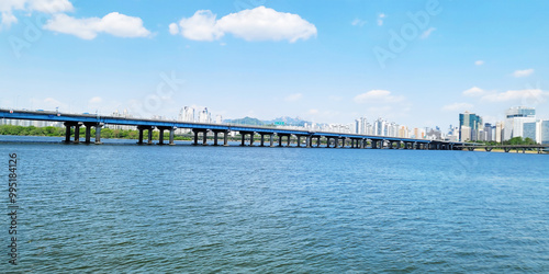 Wallpaper Mural panorama view of the river, Yeouido Hangang River Park, in Seoul, Korea, with a broad bridge, and a cityscape in the backdrop	
 Torontodigital.ca